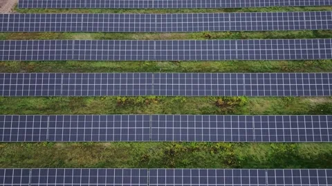 Top View of Solar Farm, Parallel Panels Harnessing Clean Energy, Natural Stock Footage 295124937