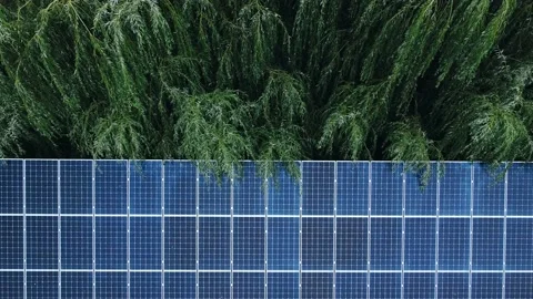Top view of solar panels in a private courtyard to supply electricity to a house Stock Footage 138451779