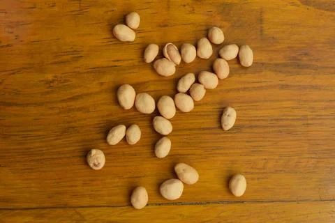 Top view of some dried atomic Nuts and food storage or jars on wooden table Stock Photos