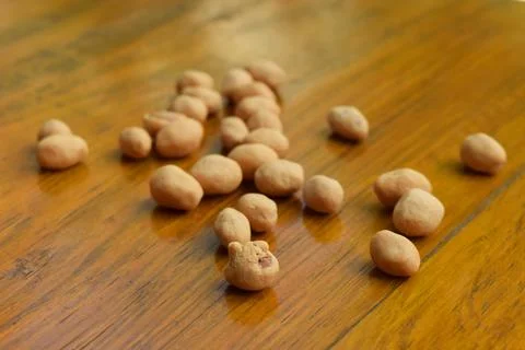 Top view of some dried atomic Nuts and food storage or jars on wooden table Stock Photos