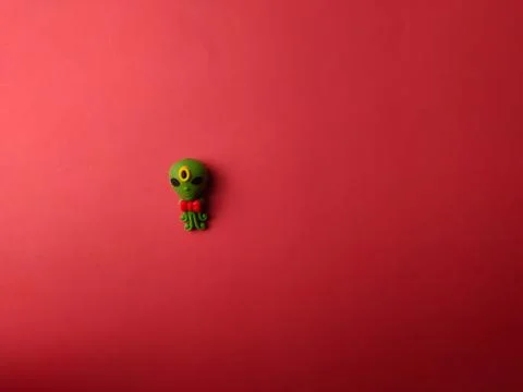 Top view space alien with copy and text space on a red background 스톡 사진