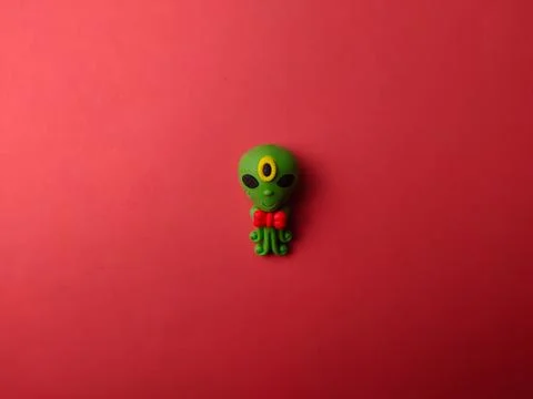 Top view space alien on a red background Stock Photos