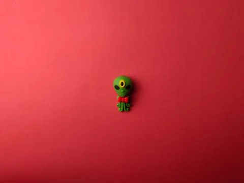 Top view space alien on a red background Stock Photos