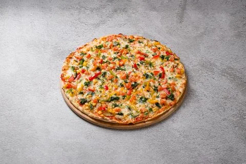 Top view of spinach vegetable pizza with colorful fresh ingredients Stock Photos