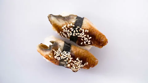 Top view of spinning two eel sushi. Stock Footage 124742501