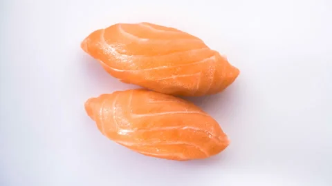 Top view of spinning two salmon sushi. Stock Footage 124741774