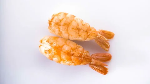 Top view of spinning two shrimp sushi. Stock Footage 124742156