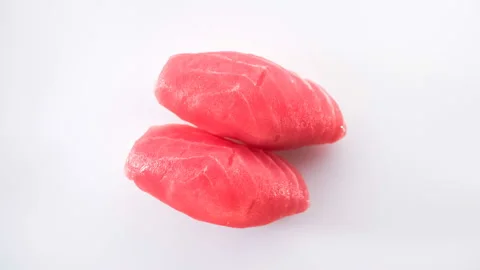 Top view of spinning two tuna sushi. Stock Footage 124741948