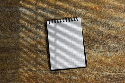Top View Spiral Notebook With Grid Paper on Rusty Textured Surface and Soft Shad Stock Photos
