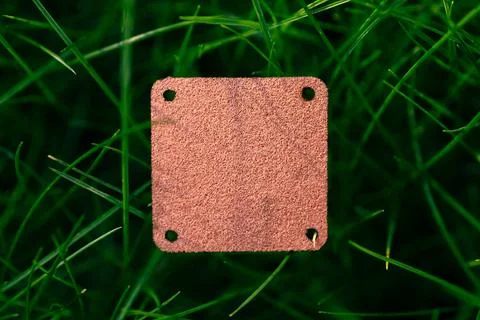 Top view of square brown leather patch for clothing creative layout of lawn Stock Photos