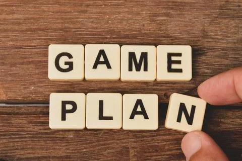 Top view of square letters with text GAME PLAN over wooden background Stock Photos