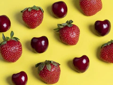 Top view of the square-shaped cherries and strawberries. Healthy food, vegeta Stock Photos
