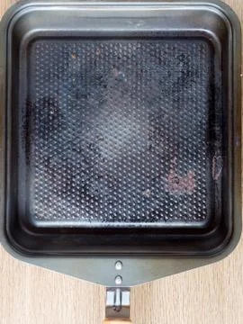 Top view of a square used iron pan Stock Photos