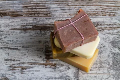 Top view stack of assorted natural soap bars. Stock Photos