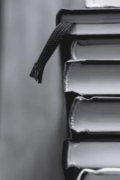 Top view of a stack of books. Black and white photography. Stock Photos