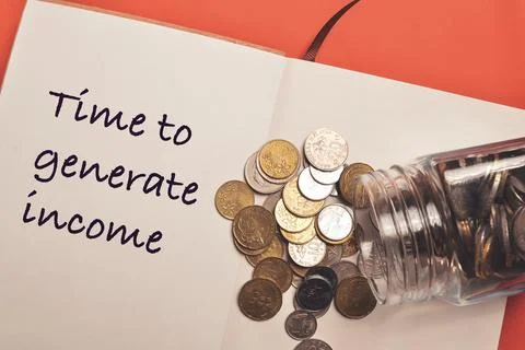 Top view stack of coins and notebook written with TIME TO GENERATE INCOME. Bu Stock Photos