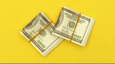 Top view of Stack of folded dollars Stock Footage 128393227