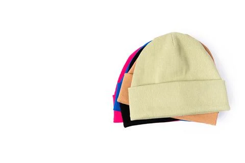Top view of stack of insulated stylish beanie hats in different colors Stock-Fotos