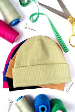 Top view of a stack of insulated stylish beanie hats in different colors Foto stock