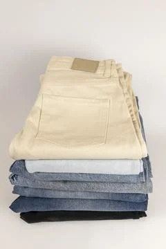 Top view of stack of jeans stacked on top of each other. Stock Photos