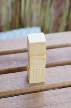 Top view of a stack of wooden blocks on a wooden table Foto stock