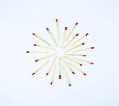 Top view of a star shape made with flammable red fire matches on a white back Stock Photos
