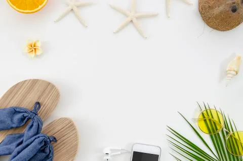 Top view starfish and shells, oranges and coconut, palm and sunglasses summer Stock Photos