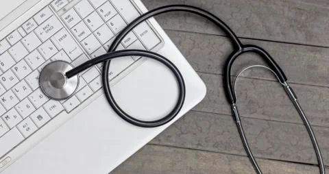 Top view of stethoscope with record information paper and Laptop. Stock Photos