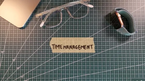 Top view of sticking TIME MANAGEMENT tape sticker near smartwatch and phone. Stock Footage 338183894