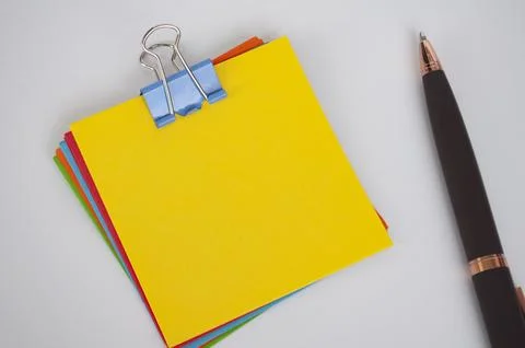 Top view of sticky notes on white background with customizable space for text Stock Photos