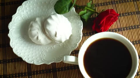 Top View of Still Life Hot Black Coffee with White Zephyr Marshmallows, Red Rose 스톡 동영상 342348968