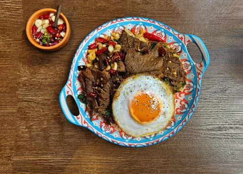 Top view of Stir fried beef with holy basil and dried chili paste over rice Stock Photos