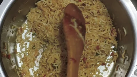 Top View of Stirring Cooked Instant Noodles in Pot Stock Footage 325525504