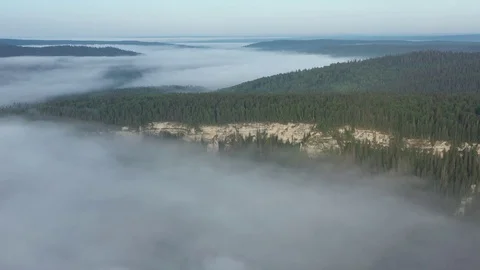 Top view of stone massif with trees that is in fog Stock Footage 120114945