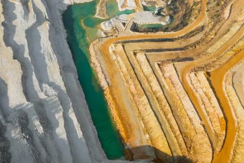 Top view on a stone quarry. Arial view on a mining of natural resources or or Stock Photos