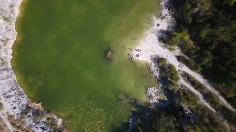 Top view of a stone quarry with a lake Stock Footage 239916663