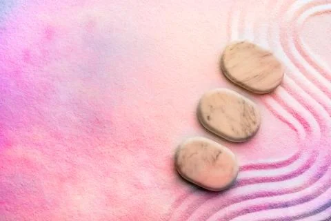 Top view of stones on sand with pattern, space for text. Zen, meditation, h.. Stockfoto's