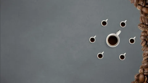 Top view. Stop motion. Coffee mugs rotating and fill with coffee 動画素材 127694329