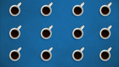 Top view. Stop motion. Coffee mugs rotating and fill with coffee. Stock Footage 127694385