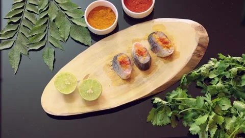 Top View Stop Motion of Raw Fish Steaks Prep with Spices, Lime, and Herbs Vídeos de archivo 340559932