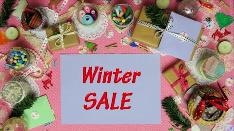 Top view stop motion on the theme of holiday with text Winter sale emerging from Stock Footage 94031087