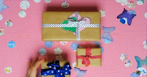 Top view stop motion on the theme of holiday. Wrapping gifts with ribbons Stock Footage 94062987