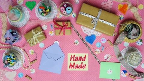 Top view stop motion on the theme of holiday with text Hand Made emerging from p Stock Footage 94124724