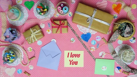 Top view stop motion on the theme of holiday with text I love you on the card em Stock Footage 94125372
