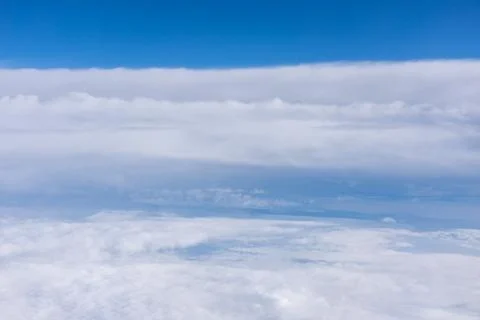 Top view of stratocumulus clouds against a clear sky Stock Photos
