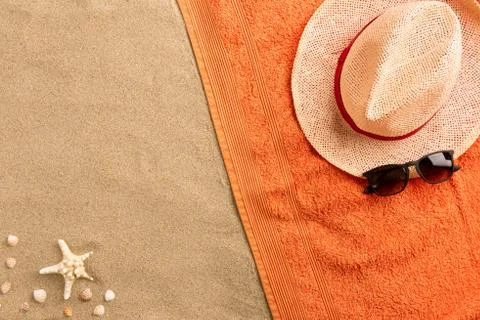 Top view straw hat and sunglasses with copy space. Traveler accessories on sa Stock Photos