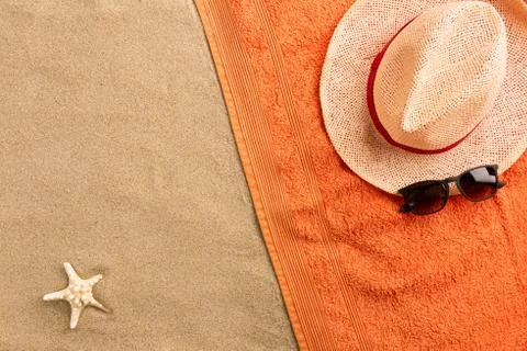 Top view straw hat and sunglasses with copy space. Traveler accessories on sa Stock Photos