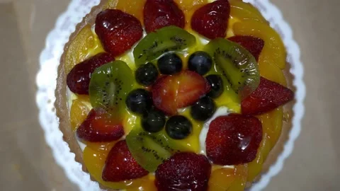 Top view of a strawberry, grape and kiwi tart cake Stock Footage 167049779