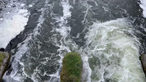 Top view of a stream of water rushing through the dam gate Stock Footage 162506428