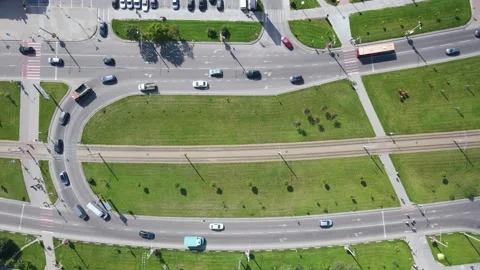 Top view of the street traffic flow and the tram moves along the tram track Stock Footage 163672436